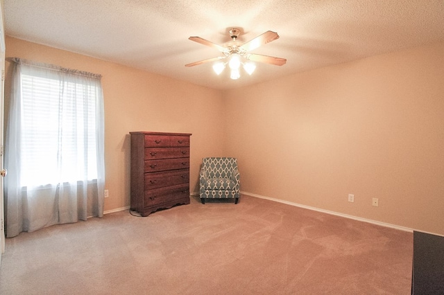 5905 Stratford Ave, San Angelo, TX 76901 - living area with baseboards, ceiling fan, and carpet