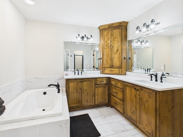 8353 Chad Rd, San Angelo, TX 76957 - full bathroom featuring marble look tiles, a bath, and double vanity