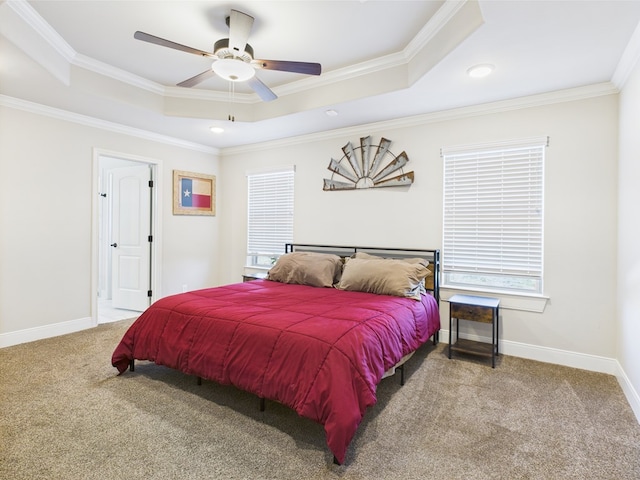 8353 Chad Rd, San Angelo, TX 76957 - carpeted bedroom featuring a tray ceiling, ornamental molding, baseboards, recessed lighting, and a ceiling fan