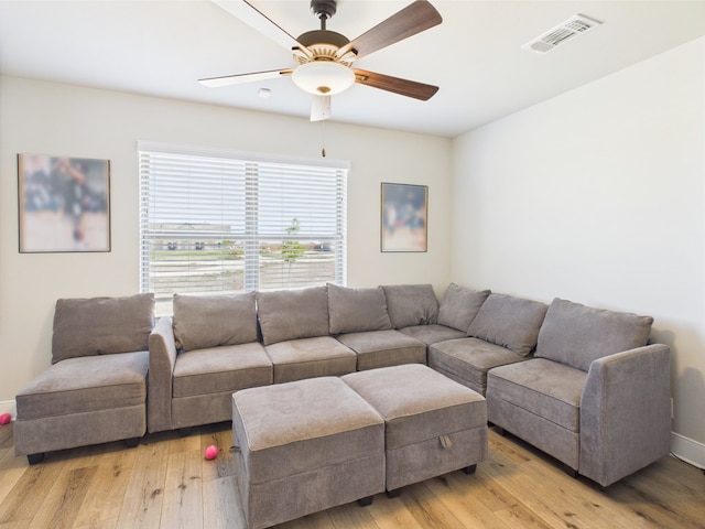 8353 Chad Rd, San Angelo, TX 76957 - living room with light wood finished floors, ceiling fan, and baseboards