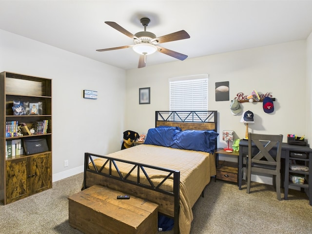 8353 Chad Rd, San Angelo, TX 76957 - carpeted bedroom featuring a ceiling fan and baseboards