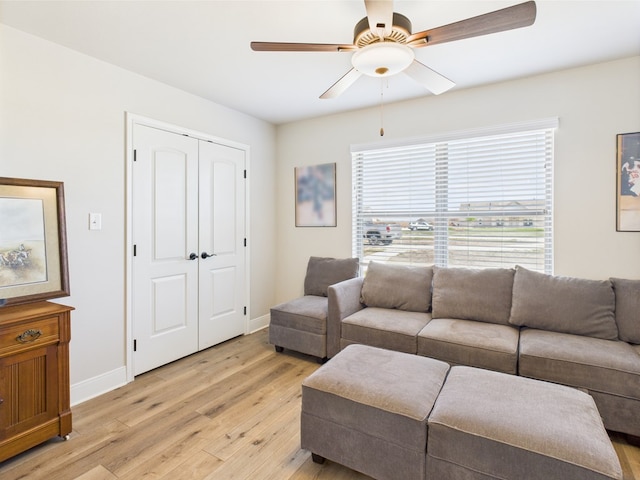 8353 Chad Rd, San Angelo, TX 76957 - living area with light wood finished floors, a ceiling fan, healthy amount of natural light, and baseboards