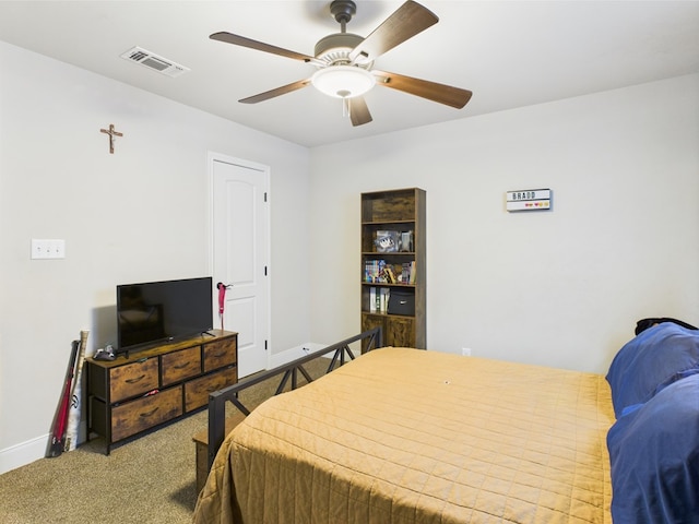 8353 Chad Rd, San Angelo, TX 76957 - carpeted bedroom with baseboards and a ceiling fan