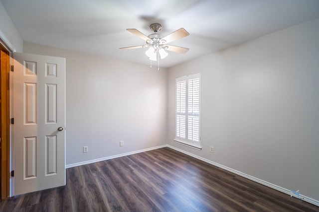 unfurnished room featuring ceiling fan and dark hardwood / wood-style flooring