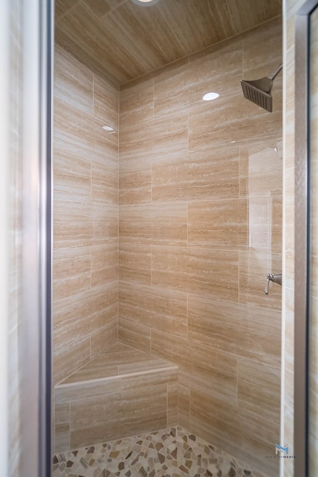 bathroom with tiled shower