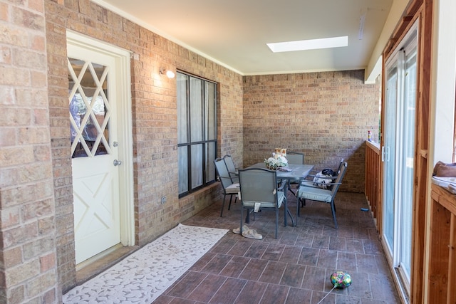 sunroom / solarium with a skylight