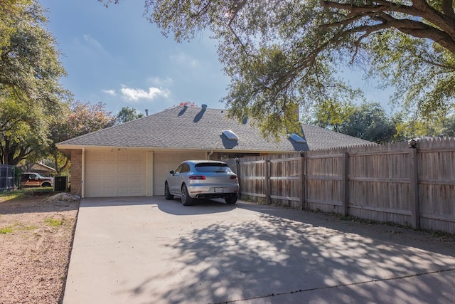 view of side of property featuring a garage