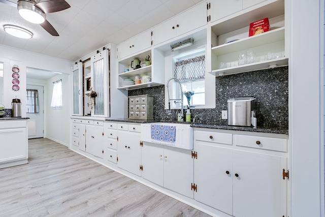 kitchen featuring tasteful backsplash, white cabinets, open shelves, and ceiling fan