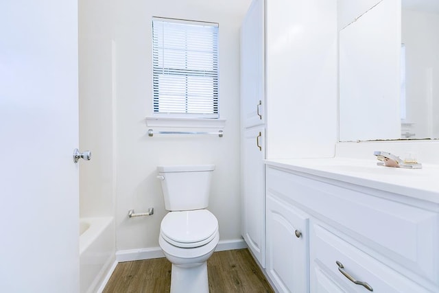 326 River Oaks St, San Angelo, TX 76903 - full bath with vanity, baseboards, toilet, and wood finished floors