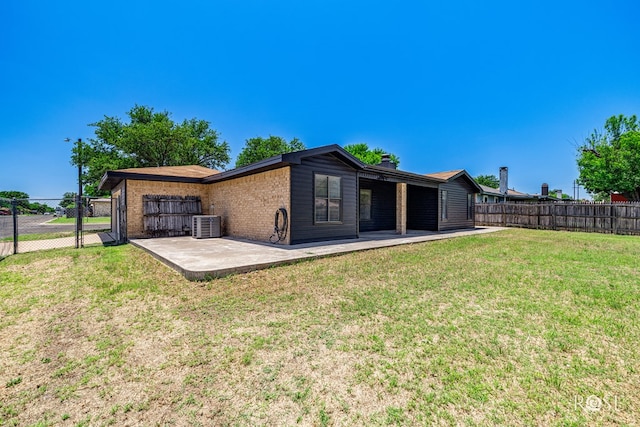 1702 Parkview Dr, San Angelo, TX 76904 - back of house with a patio area, cooling unit, and brick siding