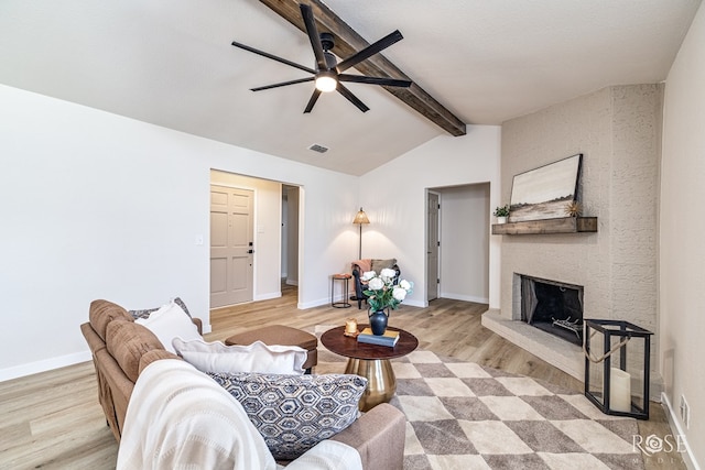 1702 Parkview Dr, San Angelo, TX 76904 - living area featuring a ceiling fan, a large fireplace, wood finished floors, and baseboards