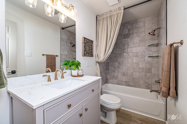 1702 Parkview Dr, San Angelo, TX 76904 - full bath with vanity, shower / bathtub combination with curtain, toilet, and wood finished floors