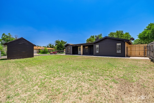 1702 Parkview Dr, San Angelo, TX 76904 - back of house with a chimney and a patio