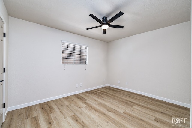 1702 Parkview Dr, San Angelo, TX 76904 - empty room with light wood-style flooring, ceiling fan, and baseboards