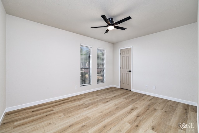 1702 Parkview Dr, San Angelo, TX 76904 - unfurnished room with light wood-type flooring, ceiling fan, and baseboards
