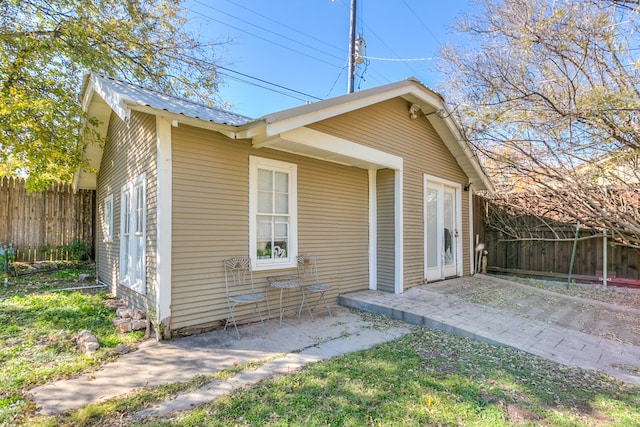 back of house with a patio