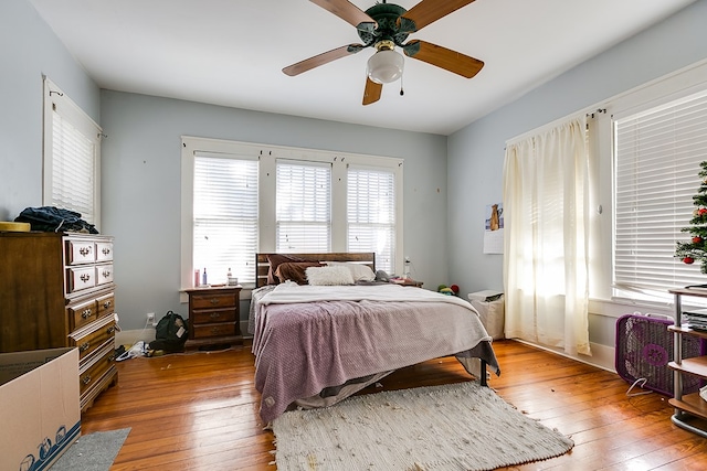 bedroom with wood-type flooring and ceiling fan