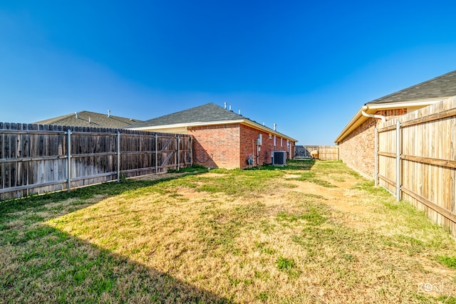 view of yard featuring central AC unit