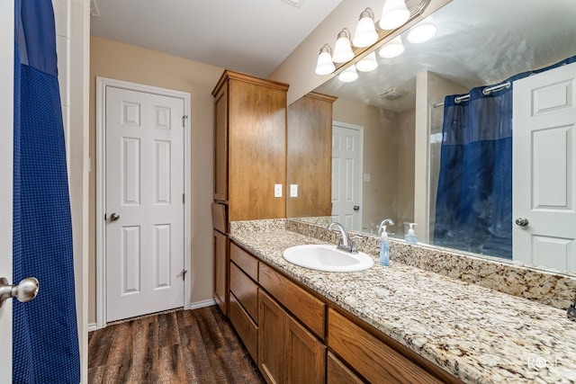 bathroom featuring vanity and hardwood / wood-style floors