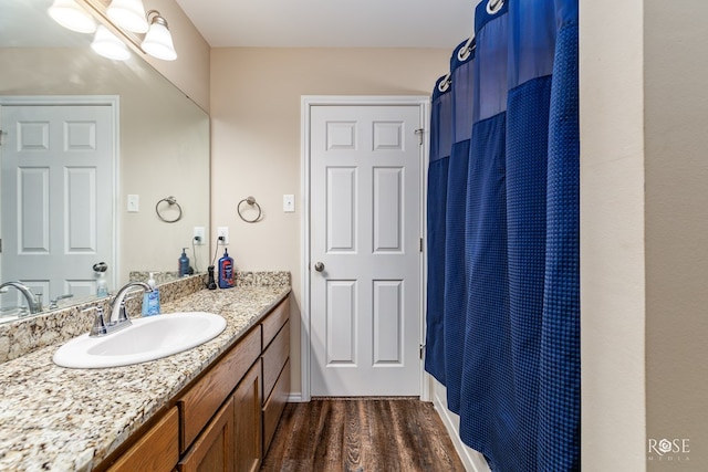 bathroom with wood-type flooring and vanity