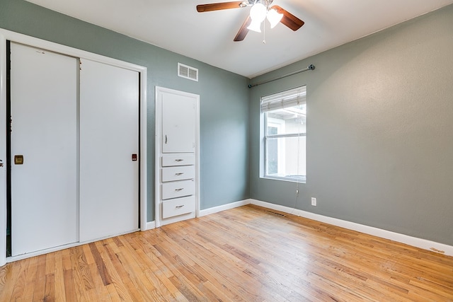 2526 Harvard Ave, San Angelo, TX 76904 - unfurnished bedroom with light wood-type flooring, baseboards, a closet, and ceiling fan