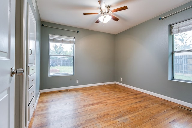 2526 Harvard Ave, San Angelo, TX 76904 - unfurnished room with plenty of natural light, light wood finished floors, and ceiling fan