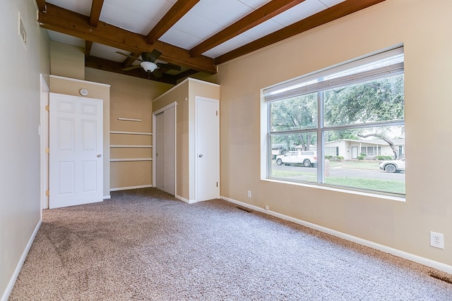 2526 Harvard Ave, San Angelo, TX 76904 - empty room featuring beamed ceiling, carpet flooring, ceiling fan, and baseboards