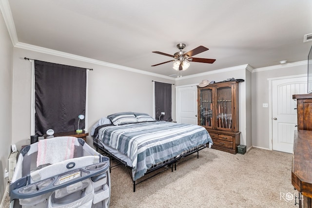 bedroom with ceiling fan, light colored carpet, visible vents, and ornamental molding