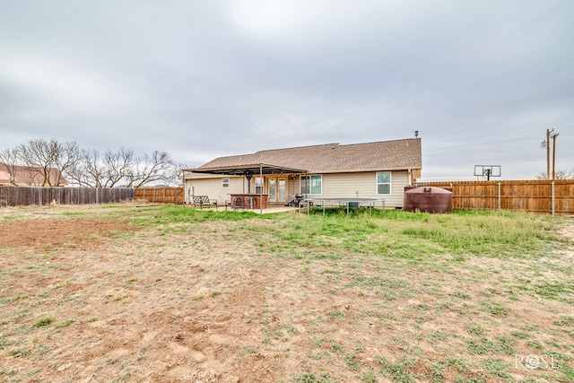 back of property with a patio area and a fenced backyard