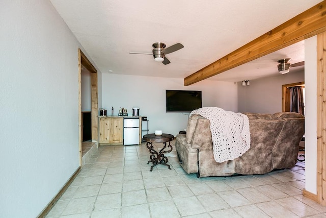 2458 Fishermans Rd, San Angelo, TX 76904 - living room featuring a ceiling fan, baseboards, and beam ceiling