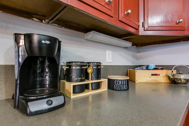 2458 Fishermans Rd, San Angelo, TX 76904 - kitchen view of reddish brown cabinets and dark countertops