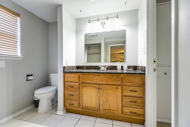 2458 Fishermans Rd, San Angelo, TX 76904 - bathroom with toilet, tile patterned flooring, vanity, and a shower