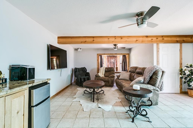 2458 Fishermans Rd, San Angelo, TX 76904 - living area featuring light tile patterned flooring, ceiling fan, beam ceiling, and baseboards