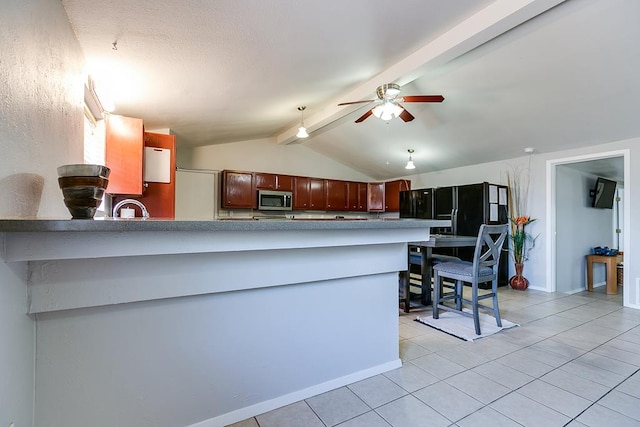 2458 Fishermans Rd, San Angelo, TX 76904 - kitchen featuring stainless steel microwave, light tile patterned flooring, a peninsula, a sink, and a ceiling fan