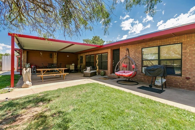 2458 Fishermans Rd, San Angelo, TX 76904 - back of house featuring a yard, a patio area, brick siding, and an outdoor living space