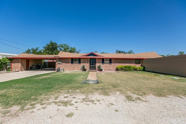2458 Fishermans Rd, San Angelo, TX 76904 - ranch-style home featuring an attached carport, concrete driveway, and brick siding