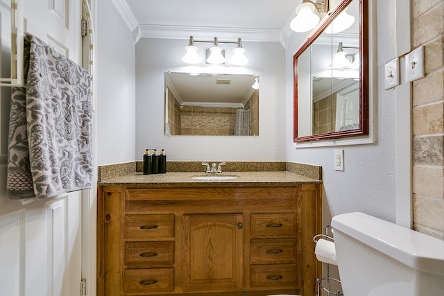 2458 Fishermans Rd, San Angelo, TX 76904 - full bath featuring ornamental molding, toilet, and vanity