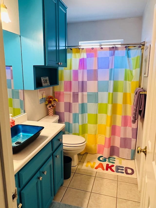1204 Sea Island Rd, San Angelo, TX 76904 - bathroom featuring tile patterned floors, vanity, toilet, and a shower with curtain