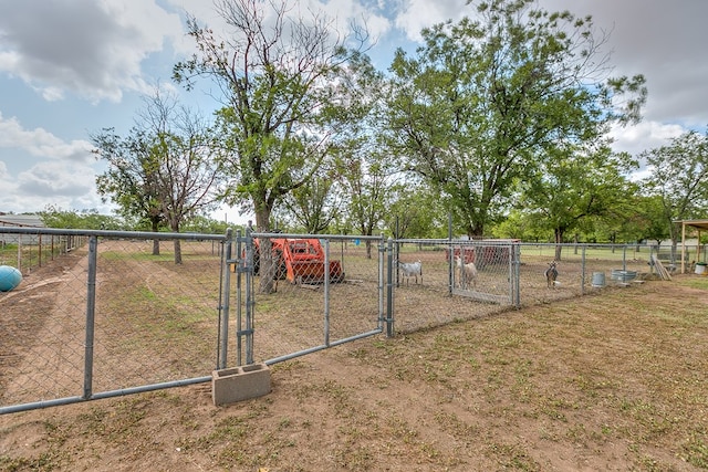 view of gate with fence