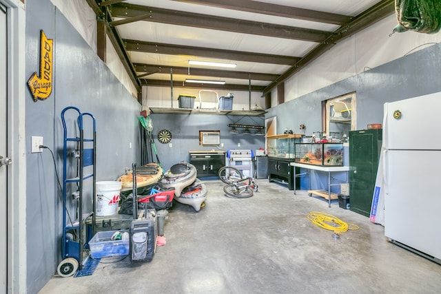 garage with freestanding refrigerator