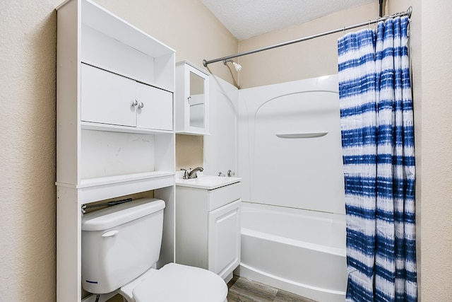 full bathroom featuring toilet, wood-type flooring, a textured ceiling, vanity, and shower / bath combination with curtain