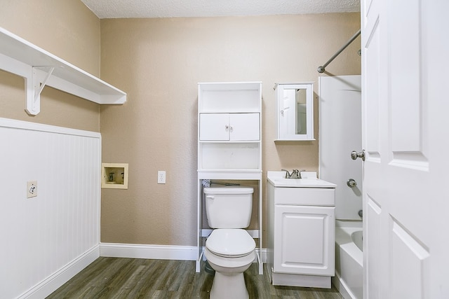 full bathroom featuring vanity, shower / washtub combination, hardwood / wood-style floors, and toilet