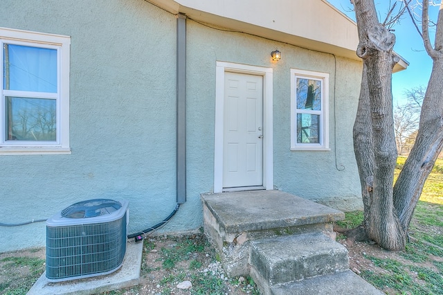 property entrance with central air condition unit