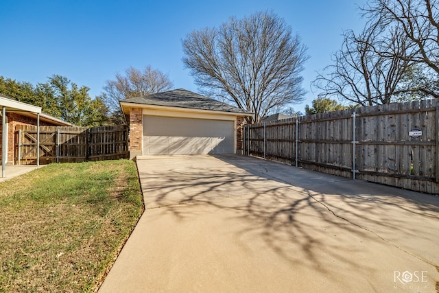 detached garage featuring fence