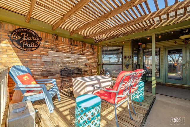 wooden terrace with a patio area and a pergola