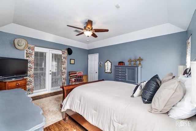 bedroom with lofted ceiling, access to outside, wood finished floors, and a ceiling fan