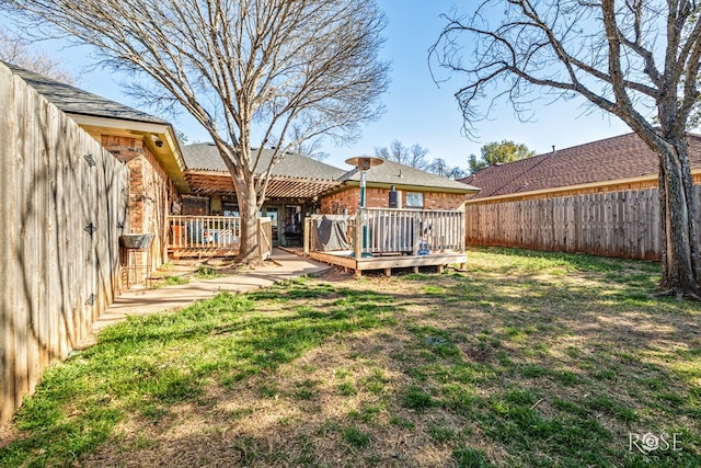 view of yard featuring a fenced backyard and a deck