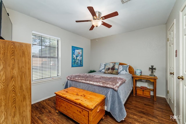 4917 Bermuda Dr, San Angelo, TX 76904 - bedroom with wood finished floors, baseboards, and a ceiling fan