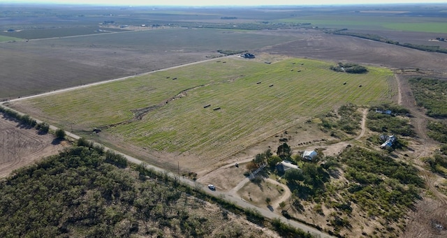 birds eye view of property with a rural view