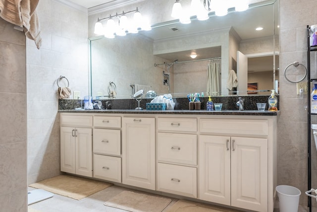 5213 Green Valley Trl, San Angelo, TX 76904 - full bathroom with ornamental molding, tile walls, double vanity, and a shower with curtain
